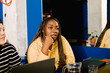 © Adrian Rodd/Stocksy - Biverse black woman attending a meeting with female entrepreneurs