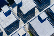 © Yic Ma/Stocksy - Aerial top view of modern industrial buildings with geometric layout