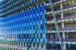 © Yic Ma/Stocksy - High rise building construction with cranes and glass facade