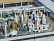 © Lawren Lu/Stocksy - Industrial facility with pipelines and exhaust scrubbers