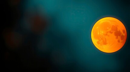 Wall Mural - A moon during golden hour, bathed in warm light, set against a blurred bokeh effect of rich, deep teal, creating a luxurious and vibrant image with sharp subject focus