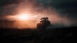 © Bussakon - A tractor plows a dusty field under a dramatic sunset sky bathed in warm cinematic light