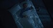 © Framestock - White Haired Man in Blue Pajamas Enters Bedroom and Lies Down on Bed. Mature Man Covers Himself With White Blanket and Looks Wearily at Ceiling. Concept Poor Sleep, Insomnia, Mental Health. Top View.
