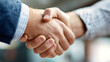 © MST BEGOM - Two business people shaking hands in a close up shot symbolizing agreement and partnership