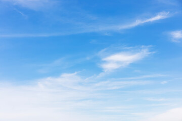 Wall Mural - fantastic soft white clouds against blue sky and copy space horizontal shape.