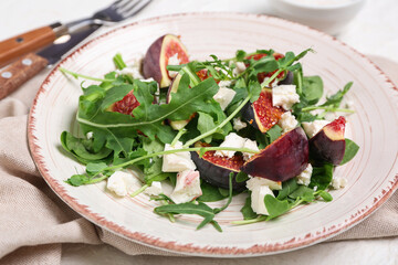 Wall Mural - Plate of tasty fig salad on white background, closeup