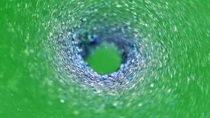 Wall Mural - Hypnotic slow motion swirl of tiny cosmic dust particles forming a mesmerizing vortex on a green screen futuristic, glimmer, dreamy