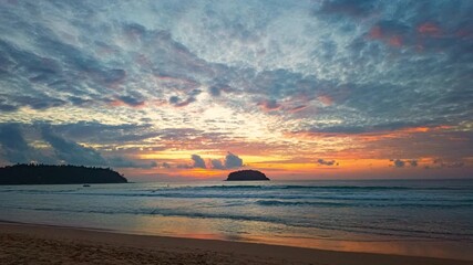 Wall Mural - Time lapse Twilight Serenity at Kata beach Phuket. Soft hues of orange, pink, and violet spread across the evening sky, merging with the calm sea in a breathtaking panorama of tropical beauty.