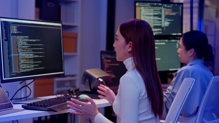 Asian software engineer or programmer team working late in development office,problem solving or algorithm of ai assistant helping for work.software developer,digital technology security concept