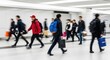 © misu - People walking in a modern building with motion blur