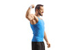 © Ljupco Smokovski - Fit man in sportswear flexing arm muscle