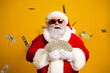 © deagreez - Santa Claus in a stylish outfit holding cash bills surrounded by falling money on a yellow background
