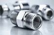 © whitestorm - Shiny chrome threaded metal fittings for industrial and plumbing systems.