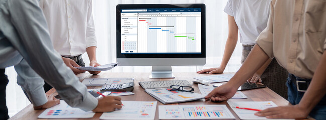 Wall Mural - Project planning software for brisk business project management on the computer screen showing timeline chart of the team project