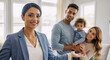 © Running opossum - cheerful professional woman introducing happy family in bright modern home interior