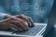 © hr-gold - Person typing on laptop computer with security network interface icons symbolizing data protection and online privacy