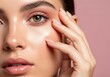© ABDULELLAH - Radiant Beauty Close-Up of a Woman's Face Showcasing Flawless Skin and Delicate Makeup on a Soft Pink Background