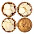 © Anwar - Four wooden bowls, three holding potato slices, one with a whole potato, viewed from above