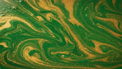 Wall Mural - A seamlessly looping video featuring a slow, elegant swirl of emerald green and gold liquid marble patterns flowing smoothly opulent, art, background