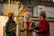 © La Famiglia - Students talking and smiling on university campus