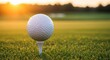 © Roman O - A golf ball sits on a tee against a vibrant green course at sunset. The warm glow of the sun creates an inviting scene for golfers to enjoy the tranquil surroundings.