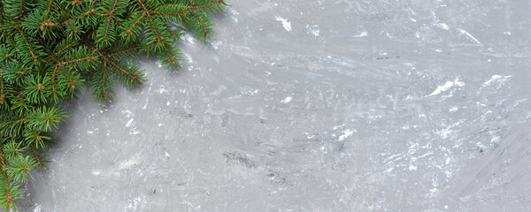 Wall Mural - Christmas gray cement background with fir tree and copy space. top view empty space for your design