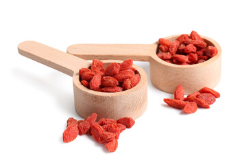 Wall Mural - Wooden spoons with red dried goji berries on white background