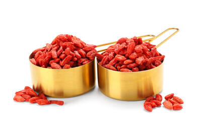 Wall Mural - Spoons with red dried goji berries on white background