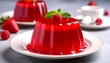 © lence - A vibrant red jelly dessert topped with mint and a fresh raspberry