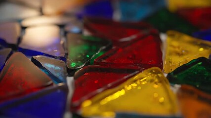 Wall Mural - abstract seamlessly looping video of vibrant colored glass shards forming a mosaic pattern with slow