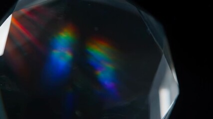Wall Mural - Cinematic shot of colorful light rays passing through an abstract glass lens or prism, creating beautiful spectrums and refractions against a dark background mysterious, color, optical