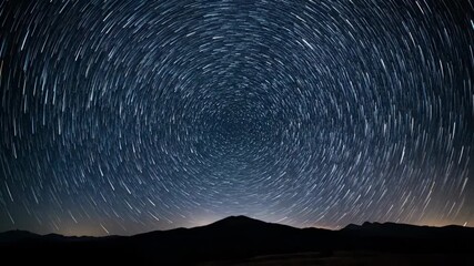 Wall Mural - Celestial bodies slowly trace glowing arcs across a pristine night sky, capturing the awe-inspiring rotation of Earth in a dramatic star trail timelapse motion, awe-inspiring rotation, constellations