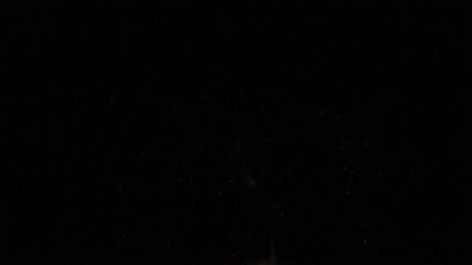 Spectacular fireworks exploding in the night sky, celebrating a special event with vibrant colors and sparkling light trails illuminating the darkness