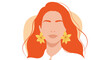 © Asif - Fashionable woman with ginger hair wearing floral earrings and peach background.