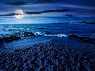 Wall Mural - sunrise on a sandy town beach in mellow season at night. beautiful and warm weather on the shores of black sea. coast in full moon light