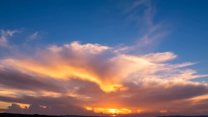 Wall Mural - majestic clouds flare with golden and pink hues as the sun rises, a stunning sky timelapse freedom, 