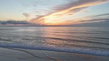 Wall Mural - Sunrise over the ocean with beautiful clouds.