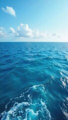 Wall Mural - Vast expanse of deep blue ocean meeting the horizon, waves gently rolling under a clear sky Perfect for travel, nature, and serenity themes , color, aquatic