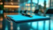 © ERiK - Notepad on a table with pen before meeting, blue tone, business concept with copy space