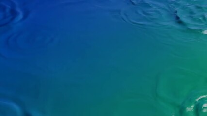 Poster - Seamlessly looping video of hypnotic sound waves rippling across a deep blue and green gradient surface tranquil, fluid, aquatic