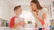 © Monkey Business - Mother And Son In Kitchen At Home Having Fun Baking Together