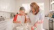 © Monkey Business - Grandmother And Grandson In Kitchen At Home Having Fun Baking Together