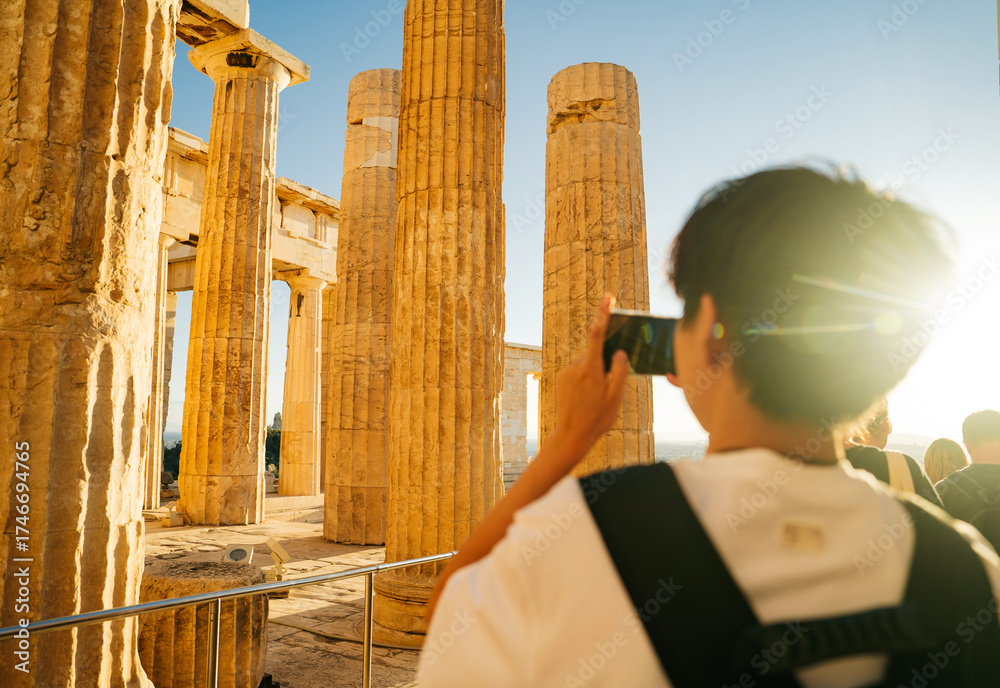 Photo Stock Traveler taking a photo inside the Acropolis of Athens ...