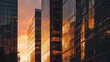 © Suresh Thangavel - Sunset reflected on modern glass skyscrapers, warm glowing tones