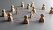© Ataur - Interconnected Wooden Figures: A Visual Representation of Social and Business Networks and Connections