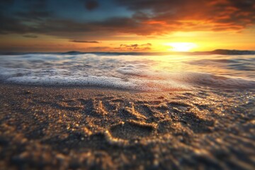 Wall Mural - Serene ocean sunset with waves gently washing over sandy beach