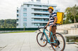 © EDER - Hispanic biker delivery man waiting for next order