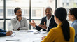 © Anuyj - Confident meeting working with diverse team in office briefing. Mixed race business leader focused on meeting, collaborating and discussing business ideas with colleagues in meeting.