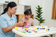 © geargodz - toddler girl with mother sculpting from plasticine at home