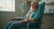 © Iryna - Chemo patient sitting in hospital chair for cancer treatment in oncology clinic, healthcare and strength